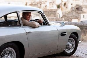 Daniel Craig as James Bond in an Aston Martin