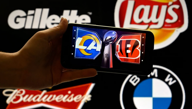 Image of the LA Rams' and Cincinnati Bengals' logos in front of the logos of Lays, BMW, Gillette and Budweiser